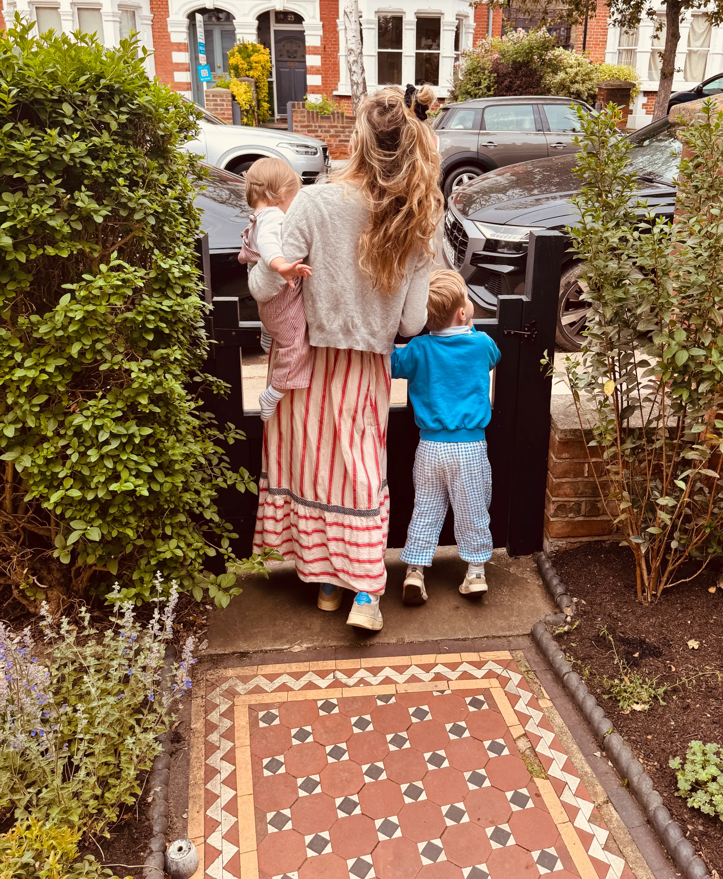 Delphi, Cressida, and Wilbur standing by a gate.