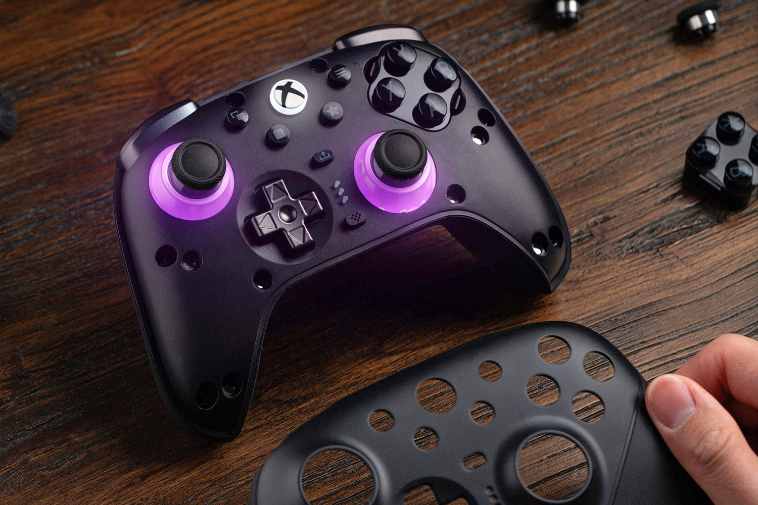 The 8BitDo Ultimate 3E controller for Xbox with its faceplate removed.