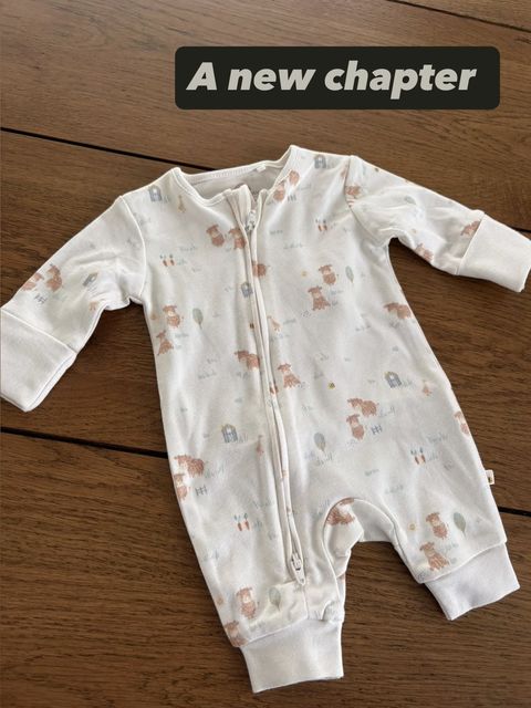 A photo of a baby grow accompanied her post.