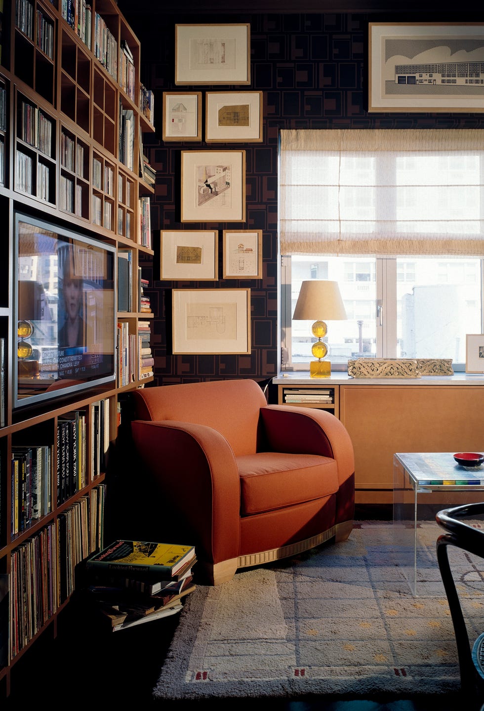 Cozy living room featuring a chair and media setup.