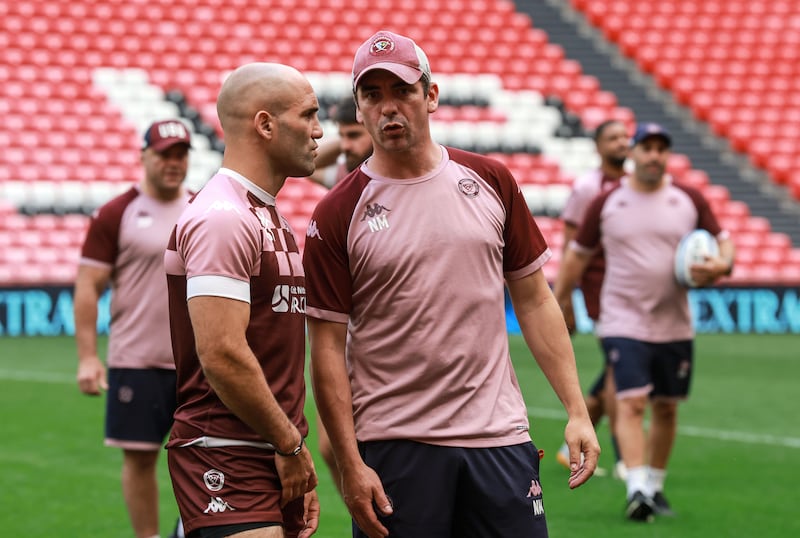Maxime Lucu of Union Bordeaux Bègles with attack coach Noel McNamara at San Mamés Stadium, Bilbao. Photograph: Dan Sheridan/Inpho