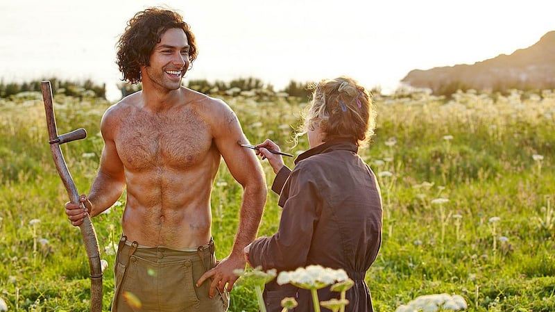 Aidan Turner gets brushed up for his role as Ross Poldark by crew in a behind-the-scenes publicity shot for the drama. Photograph: BBC