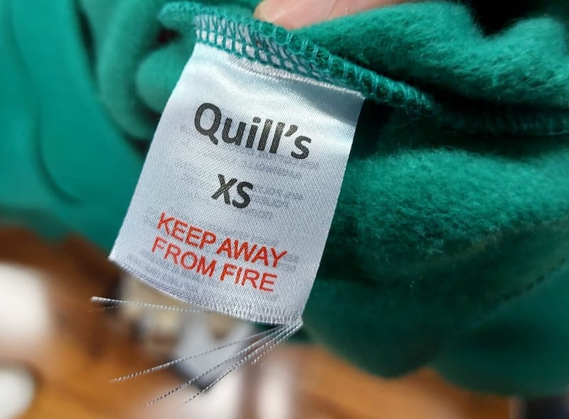 A cut care label on a jumper on sale in a Quills outlet. Photograph: CCPC