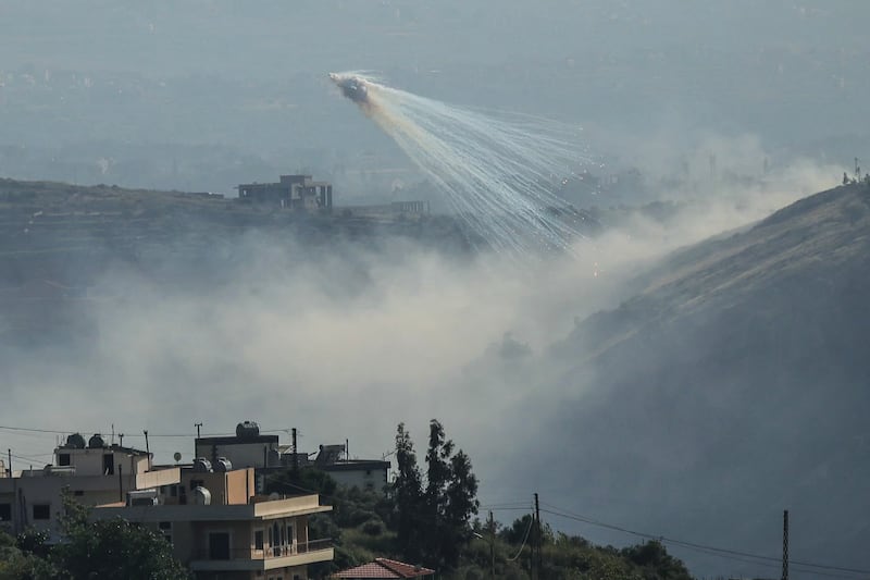 Trails of smoke fall from the sky during Israeli shelling on the outskirts of the Lebanese village of Yohmor on Sunday. Photograph: AFP via Getty