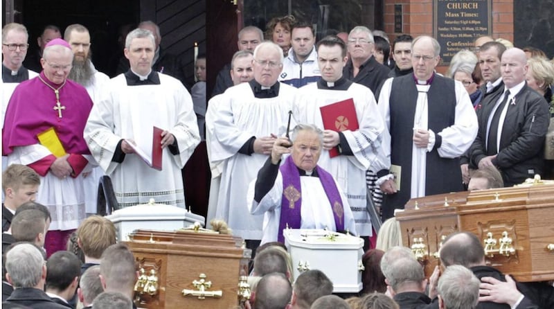 Fr Patrick O'Kane blessing the coffins of those who died in the Buncrana Pier tragedy that claimed five lives