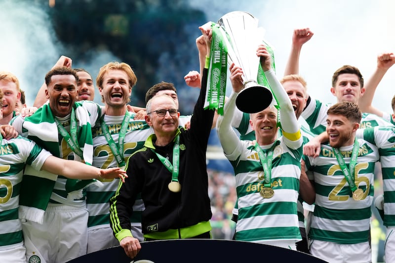 Celtic manager Martin O'Neill with the Scottish Premiership trophy following his side's title-clinching victory against Hearts at Celtic Park on Saturday. Photograph: Andrew Milligan/PA Wire