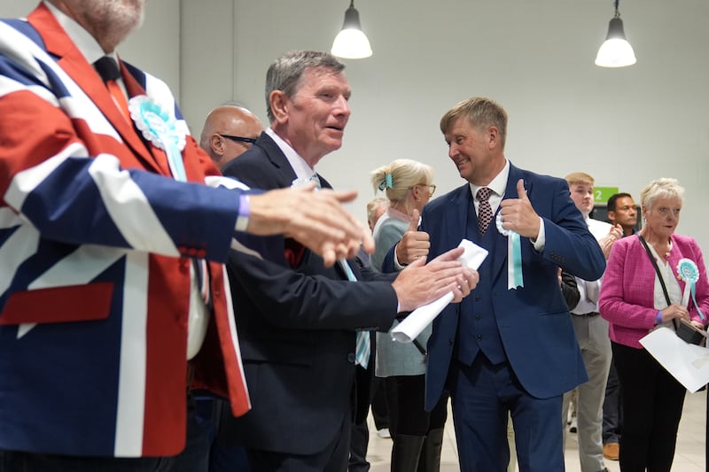 Newly elected Reform UK councillors Jeff Bray (left) and Peter Harris (right) celebrate during the 2026 Essex County Council election at Clacton Leisure Centre in Essex. Photograph: Joe Giddens/PA Wire