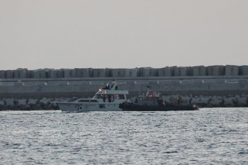 A boat bearing symbols of one of the vessels belonging to the Gaza-bound aid flotilla is motored towards the Israeli port of Ashdod on Tuesday after being intercepted by Israeli forces. Photograph: Jack Guez/AFP via Getty