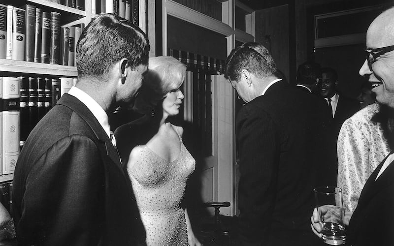 US president John F Kennedy (with his back to the camera) and Marilyn Monroe at Madison Square Garden in New York in 1962. Photograph: Cecil W Stoughton / The White House