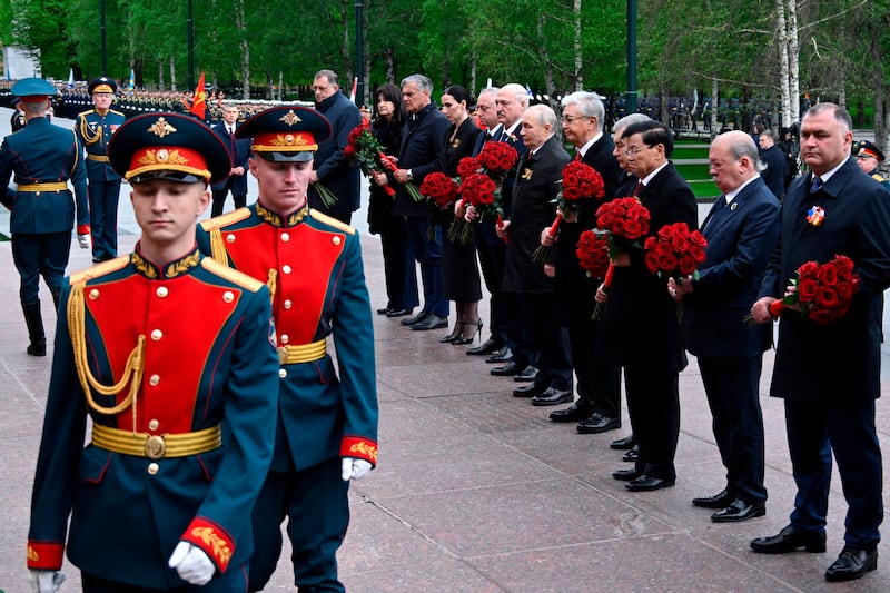 Vladimir Putin and other foreign leaders attend a ceremony to lay flowers at the Tomb of the Unknown Soldier by the Kremlin wall in Moscow. Photograph: Alexander Nemenov/Pool Photo via AP