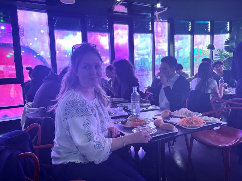 Naomi O'Leary enjoys a meal in the interior of the barge university canteen