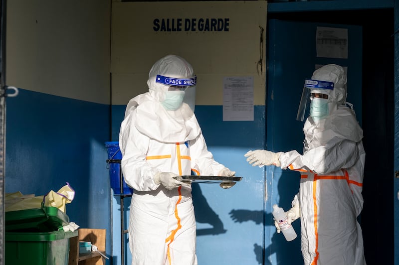 Health workers prepare medicine for patients with Ebola at the Rwampara General Referral Hospital in Ituri Province, eastern Democratic Republic of Congo. Photograph: Arlette Bashizi/The New York Times
                      