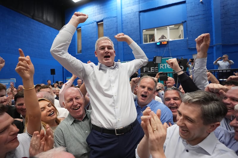 Seán Kyne celebrates with Tánaiste and Fine Gael leader Simon Harris and supporters after winning the Galway West byelection. Photograph: Niall Carson/PA Wire