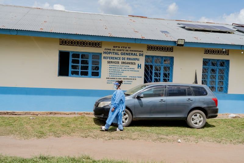 A health worker wearing protective gear walks outside a hospital in Bunia. Photograph: Jorkim Jotham Pituwa/AP