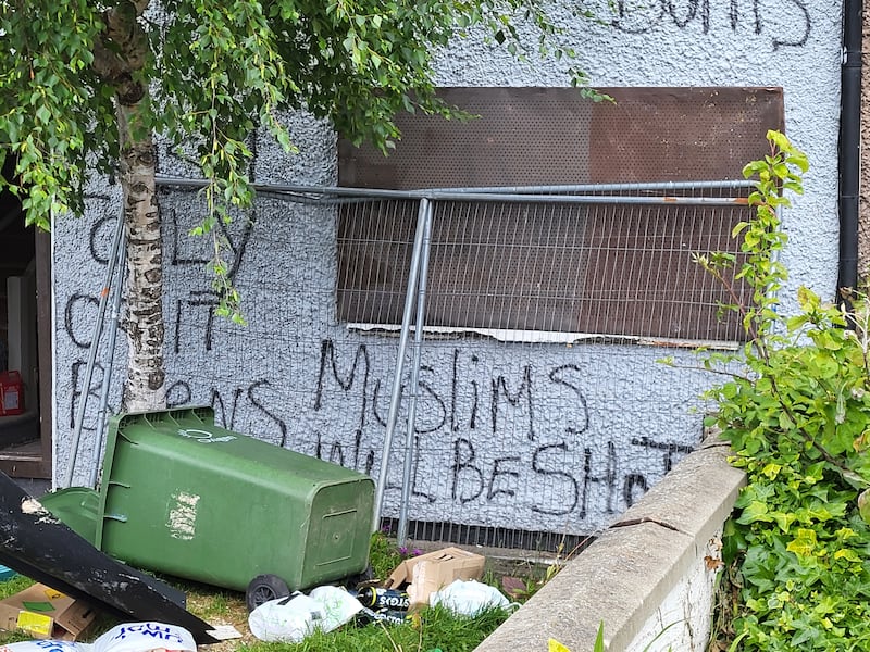 Graffiti on a boarded-up council house in Dublin. Photograph: Conor Lally