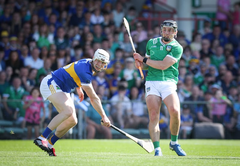 Limerick's Aidan O'Connor shoots past Bryan O'Mara of Tipperary to score his side's fourth goal of the match at the  Gaelic Grounds on Sunday. Photograph: Tom Maher/Inpho
