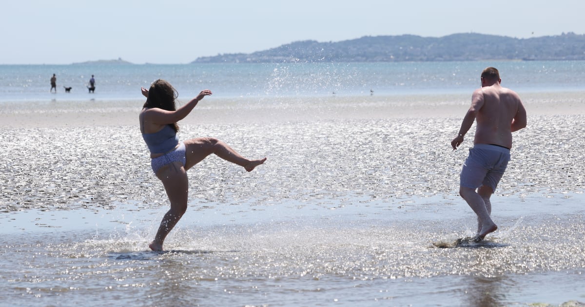 ‘It’s like Costa del Raheny’: Beachgoers in Dollymount make hay while the sun shines – The Irish Times