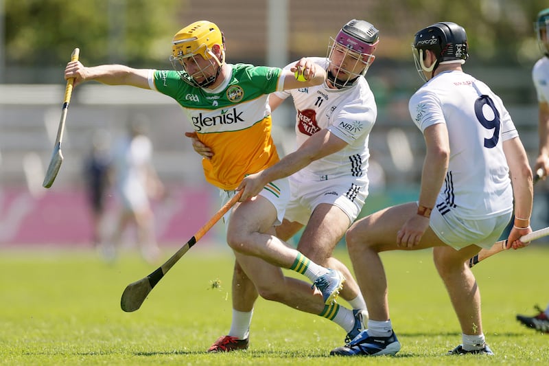 Offaly's Patrick Taaffe is tackled by Kildare's Cathal Dowling. Photograph: Laszlo Geczo/Inpho