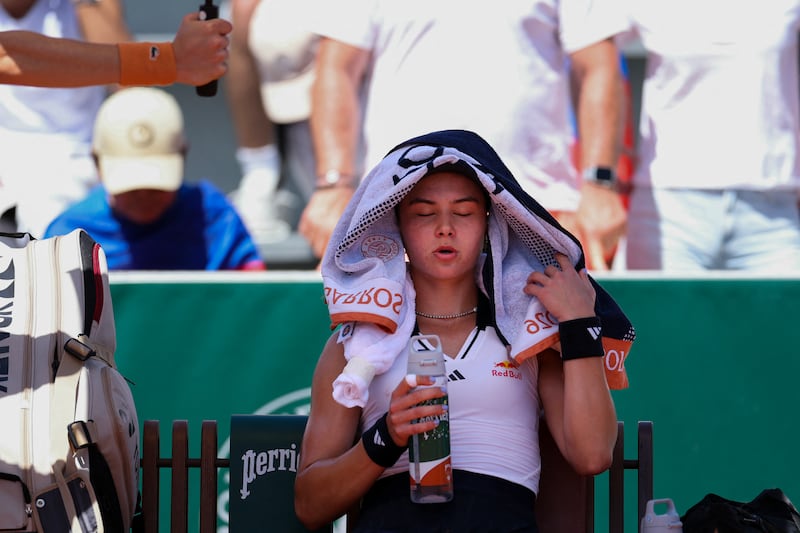 Iva Jovic shelters from the heat at the French Open tennis tournament at the Roland-Garros Complex in Paris. Photograph: Alain Jocard/AFP/Getty Images