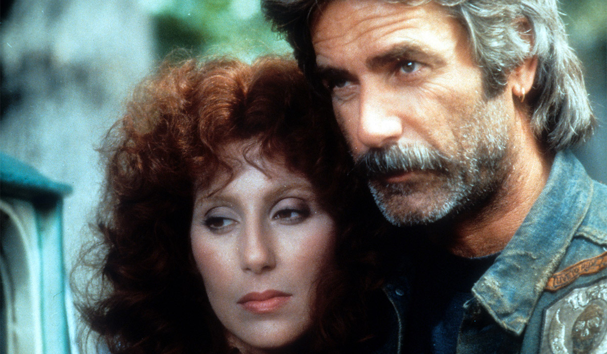 Cher leaning against Sam Elliott in a scene from the film 'Mask', 1985. Pic: Getty Images