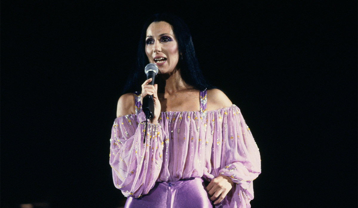 American singer and actress Cher performing in a lavender ruched top and trousers, 1980. Pic: Getty Images