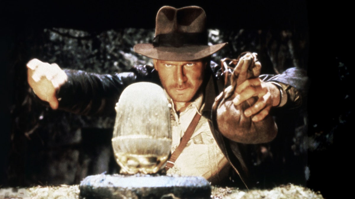 American actor Harrison Ford standing on the set of Raiders of the Lost Ark