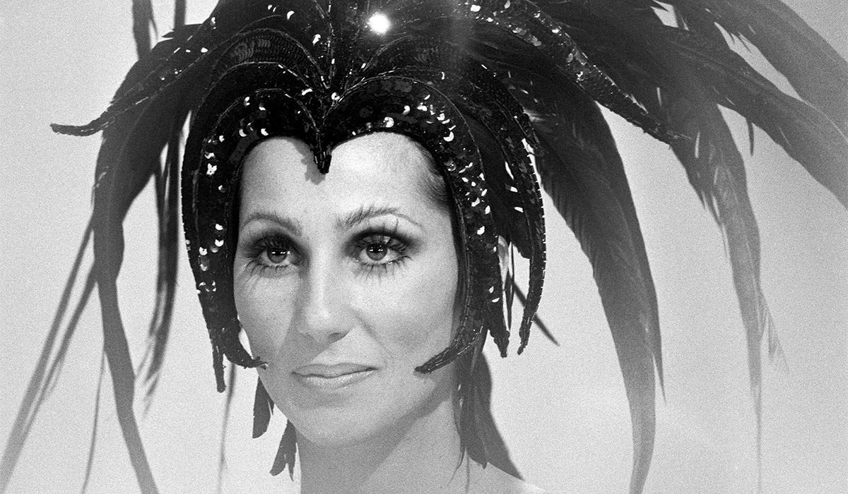 Portrait of American singer and entertainer Cher (born Cherilyn Sarkisian LaPiere) in a large, feathered headdress on an episode of 'The Sonny and Cher Comedy Hour,' January 18, 1973. Pic: Getty Images