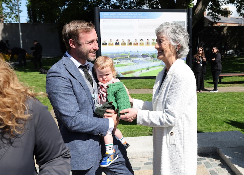 Seán Greif, a great-grandnephew of Rising leader Micheál Hanrahan, and Ailbhe Greif meet President Catherine Connolly. Photograph: Dara Mac Dónaill/The Irish Times