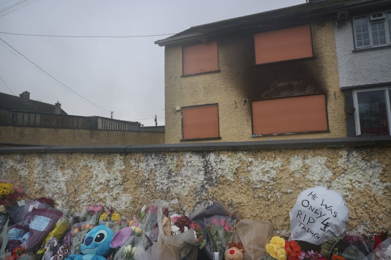 Flowers and toys outside the Castleview Park house where Tadhg Farrell (4) and his great-aunt Mary Holt (60) died in a firebomb attack in Edenderry, Co Offaly. Photograph: Bryan O’Brien
