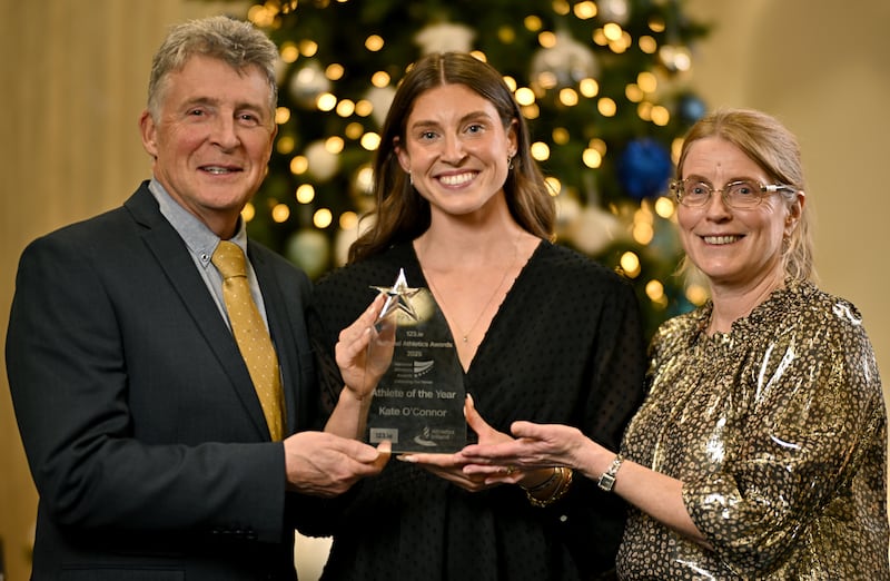 Kate O'Connor with her parents, Michael and Valerie, after winning athlete of the year at the 2025 National Athletics Awards in Dublin. Photograph: Sam Barnes/Sportsfile