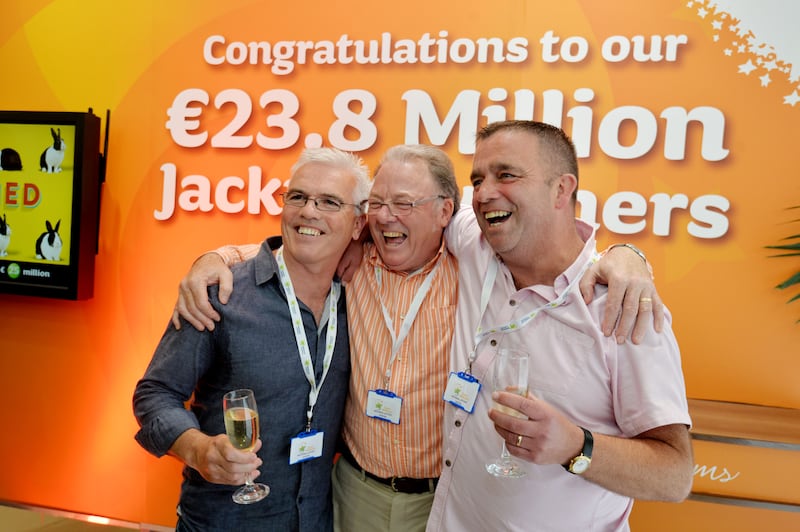 Three of the 22 members of a Dublin Bus lotto syndicate at the Broadstone depot collect their €23.8m winnings in July 2016. Photograph: Alan Betson