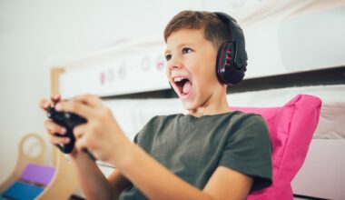 Little boy with gamepad playing video game at home
