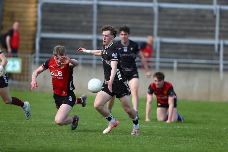 Sligo's Adam Feeney scores the only goal of the game as Downs Oisin Murphy attempts to block the shot