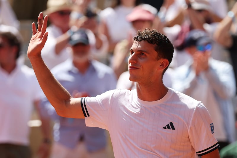 Juan Manuel Cerundolo of Argentina shows appreciation to the fans after victory over Jannik Sinner. Photograph: Matthew Stockman/Getty Images