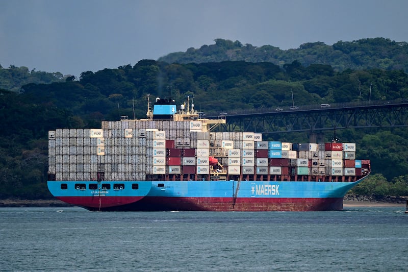 A similar cargo ship carrying containers from the Danish company Maersk photographed sailing through the Panama Canal. Photo by MARTIN BERNETTI / AFP via Getty Images