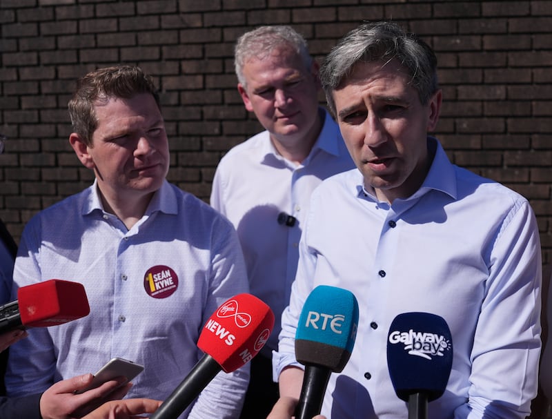 Tánaiste and Fine Gael leader Simon Harris speaks to media in Galway on Sunday alongside Minister for Enterprise Peter Burke and party candidate Seán Kyne 
Photograph: Niall Carson/PA Wire
