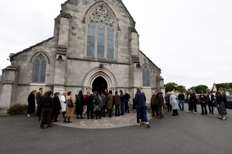 Mourners gather outside The Victorian Chapel at Mount Jerome in Dublin. Photograph: Nick Bradshaw