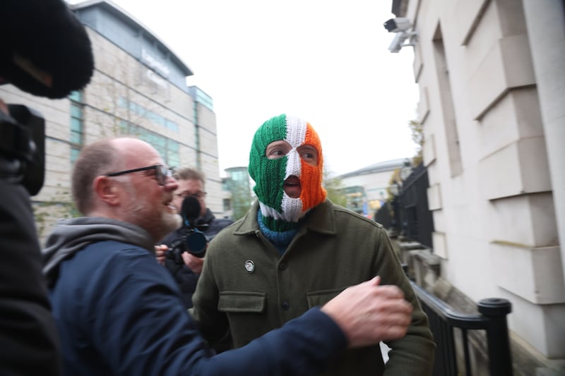 DJ Próvaí  with Trevor Birney  as  West Belfast rap group Kneecap is to donate more than £7,000 to a youth group on the loyalist Shankill Road after taking a High Court case against the British government.
PICTURE COLM LENAGHAN