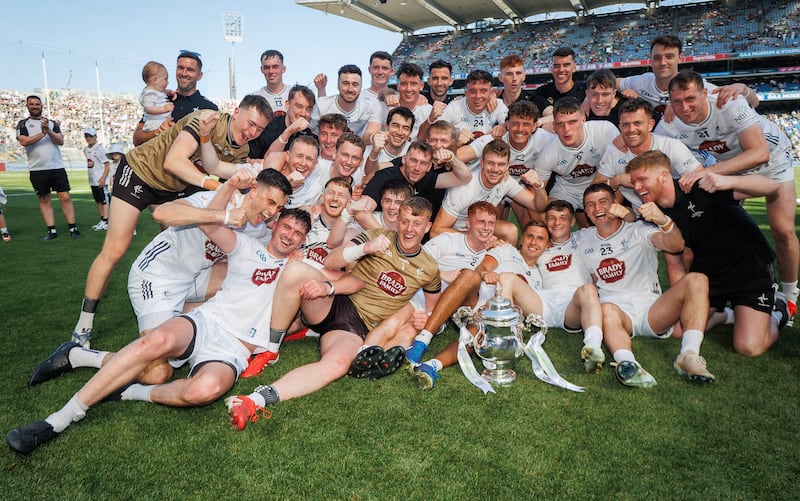 Kildare celebrate with the Tailteann Cup front and centre after victory over Limerick in 2025. Photograph: Inpho