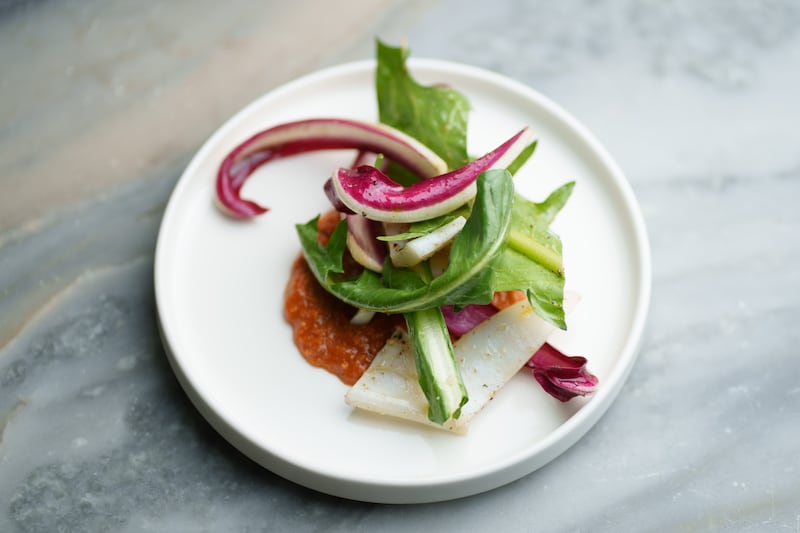 Grilled squid, bitter leaves and romesco sauce at Mongoose on Thomas street. Photograph: Fran Veale