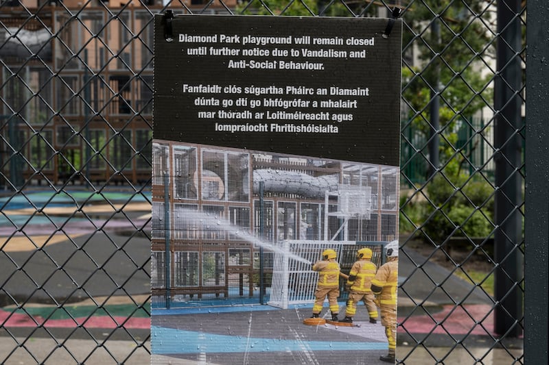 A sign placed on a fence in the park. Photograph: Paulo Nunes dos Santos