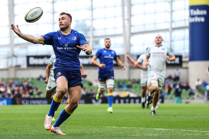 Leinster's Jordan Larmour gathers the ball to run in his side's sixth try. Photograph: Ben Brady/Inpho