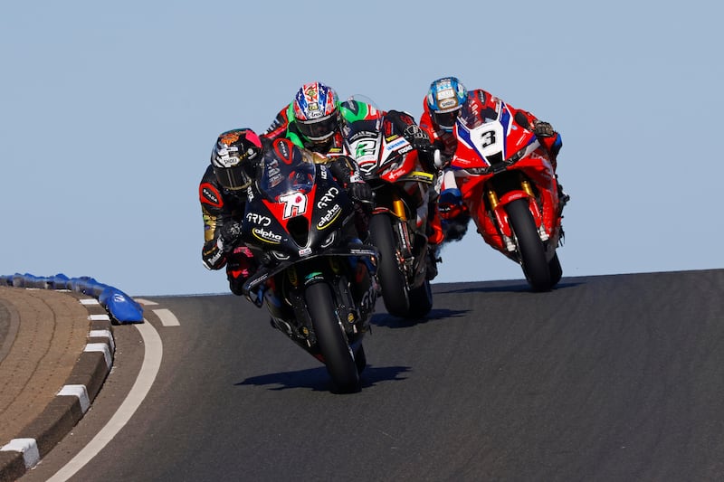 Rod Neill/Pacemaker Press 09/05/2026: Storm Stacey (CD Racing Alpha Racing BMW) leads the pack at Black Hill during the Merrow Hotel and Spa Superbike race at the Briggs Equipment NW200 on Saturday. Photo by Rod Neill/Pacemaker Press