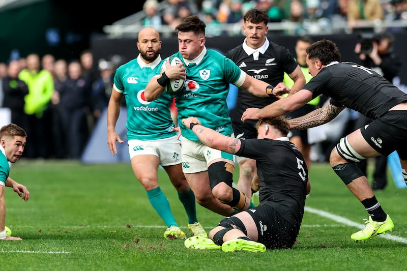 Ireland's Dan Sheehan is tackled by Fabian Holland of New Zealand. Photograph: Gary Carr/Inpho