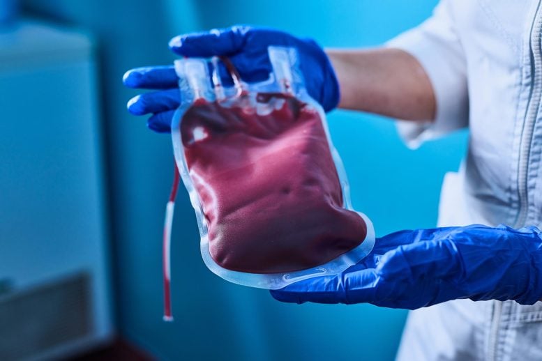 Scientist Holding Red Blood Bag