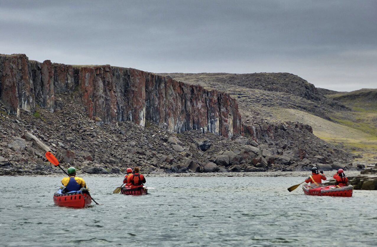 several canoeists on tundra river