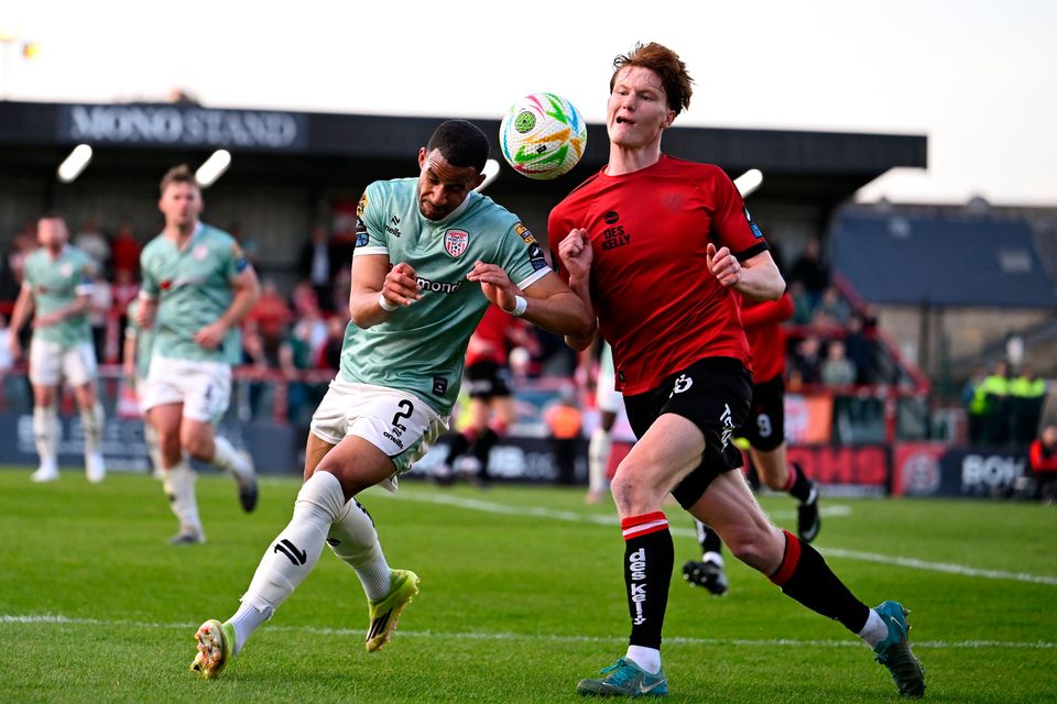 Barry Cotter of Derry City in action against Senan Mullen of Bohemians