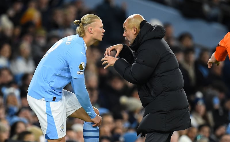 City manager Pep Guardiola gives instructions to Erling Haaland before sending him on to replace Kevin De Bruyne against Burnley FC in 2024. Photo: Peter Powell/ EPA-EFE