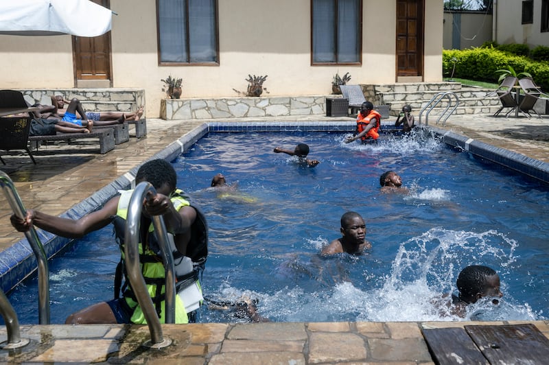 Residents in a hotel pool in Bunia, the heart of the Ebola outbreak in the Democratic Republic of Congo, on Saturday. Photograph: Arlette Bashizi/The New York Times