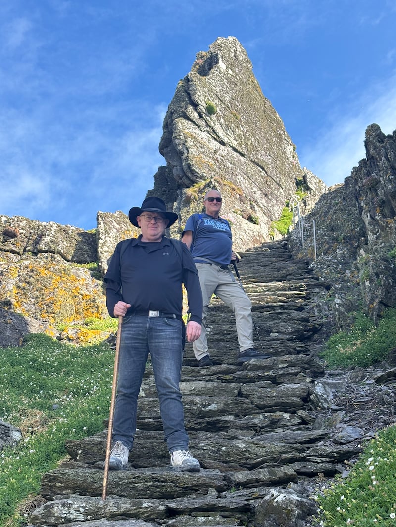 Barry Healy from Cork and his brother-in-law Charlie Bonin (63) from Australia descending the steps from the monastery on Skellig Michael. Photo: Simon Carswell